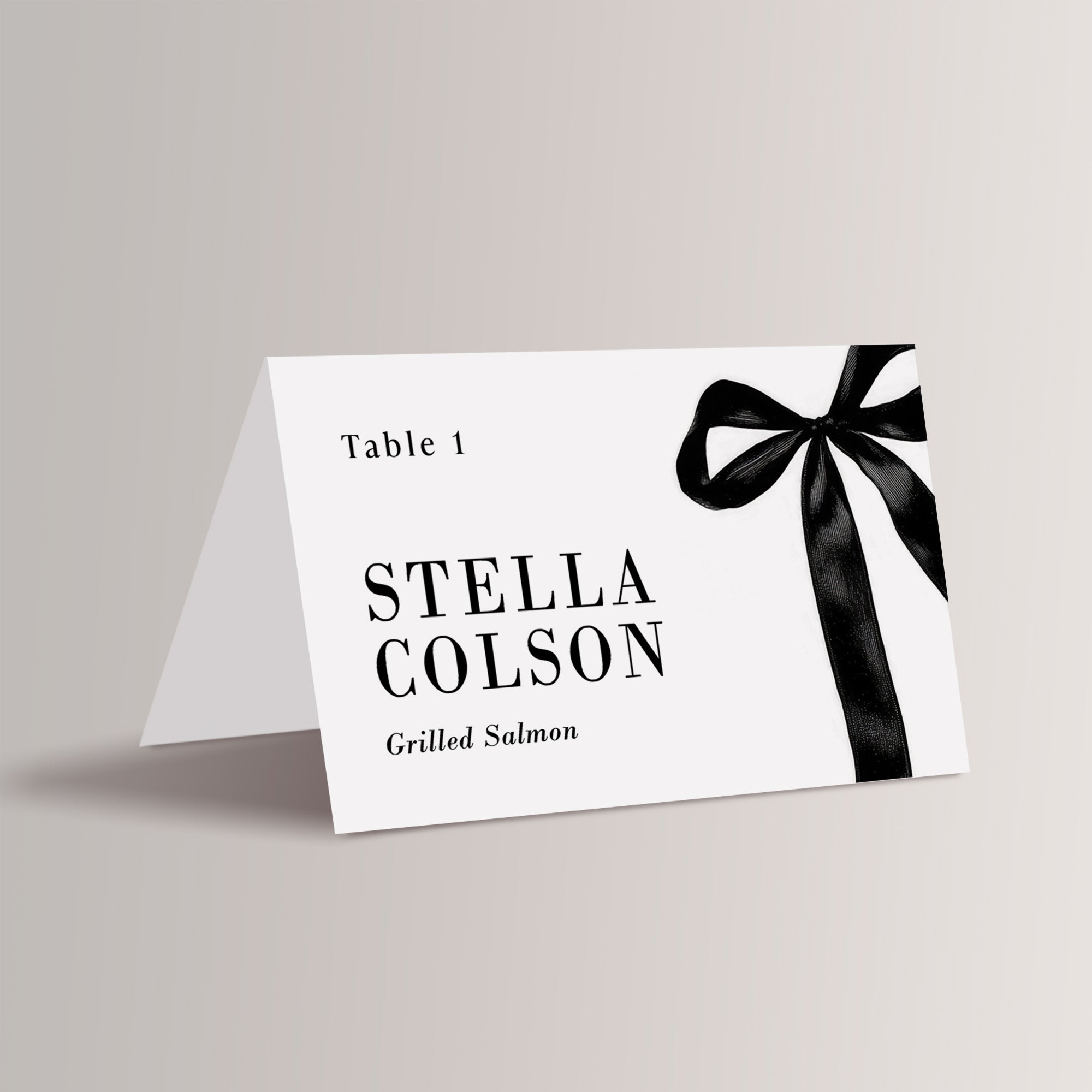 Elevate your wedding reception with our elegant black bow or ribbon place cards. Featuring a timeless black-and-white design and sophisticated script font, these personalized name cards not only guide guests to their seats but also serve as stylish meal indicators. Perfect for a chic and romantic wedding celebration.