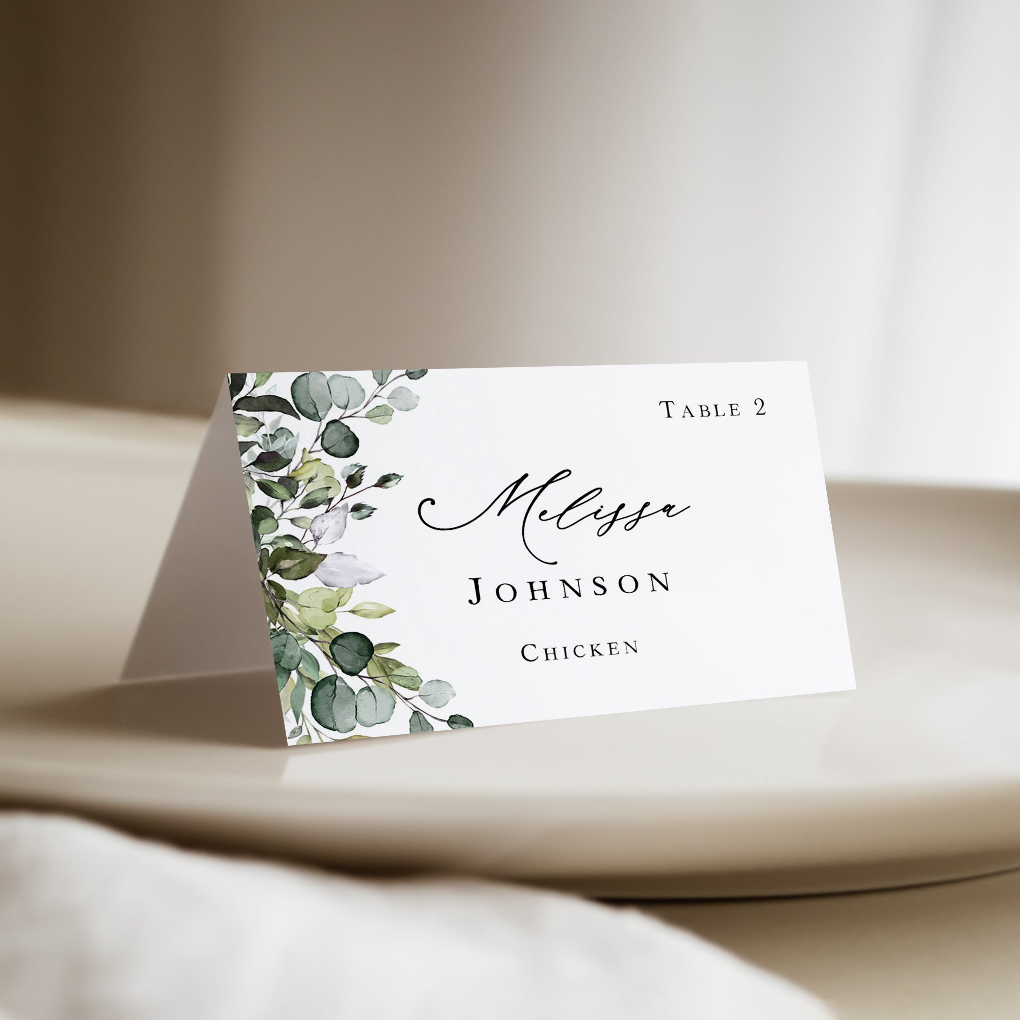 Eucalyptus greenery wedding place card with meal choice and a script font that are personalized and printed for you.