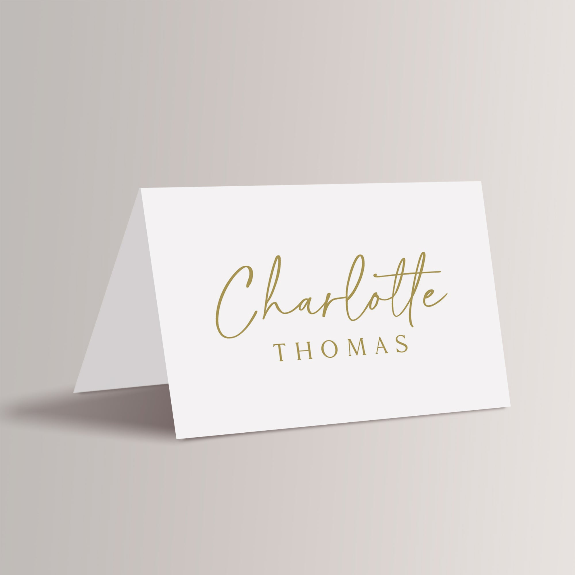 Add a touch of elegance to your wedding reception, rehearsal dinner, birthday party or business party with our personalized wedding place cards. Featuring a minimalist gold and white design with a sophisticated script font, these printed place cards are perfect for any modern or simple wedding. 