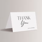 Express your gratitude with timeless elegance using these black-and-white wedding thank you cards. Designed with sleek lines and a refined blend of script and serif fonts, these minimalist cards perfectly complement your modern wedding. Personalize with your names for a thoughtful and stylish touch that reflects the beauty of your celebration.