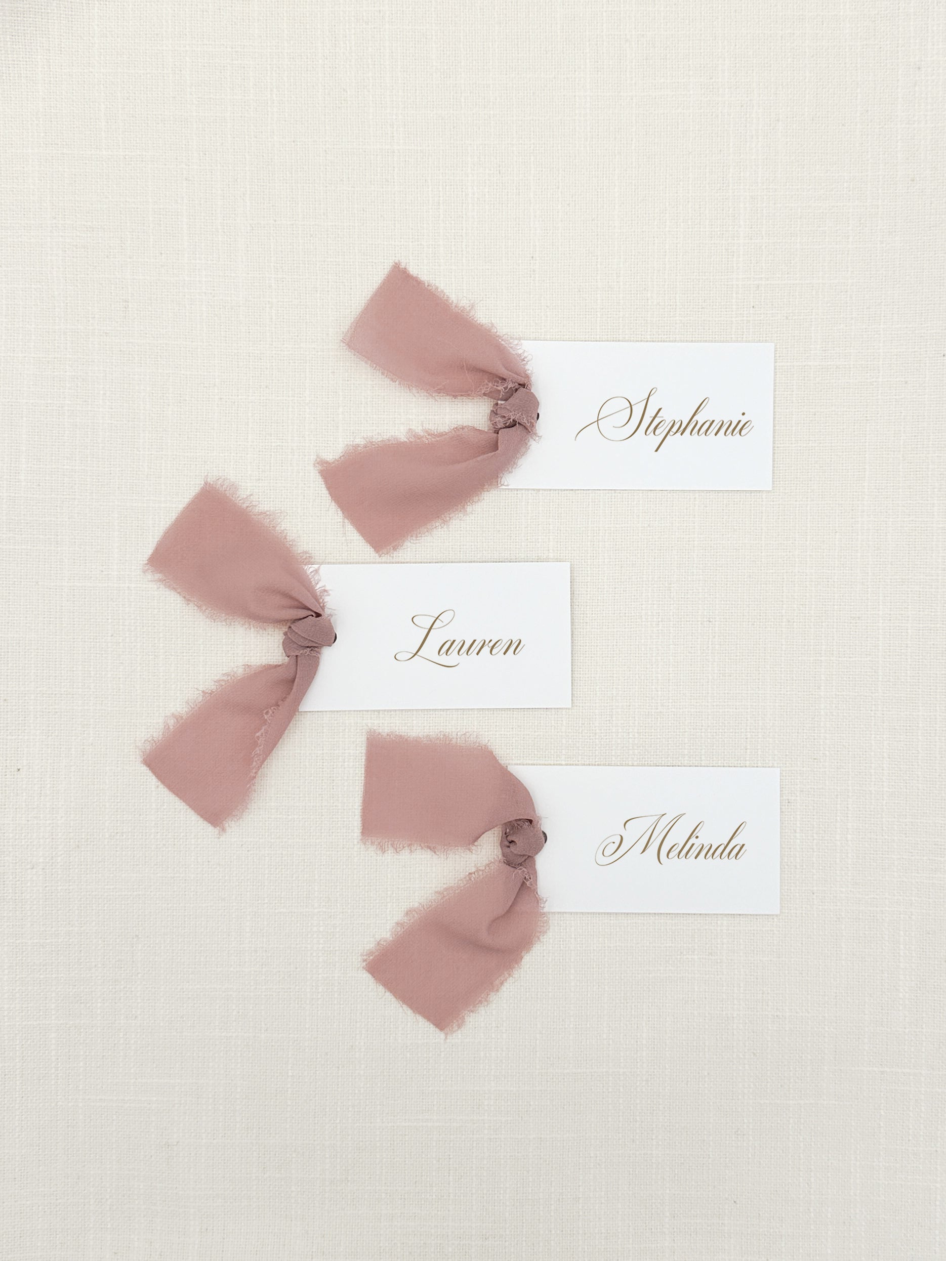 Personalized Shower Name Cards with Chiffon Ribbon that are printed for you with gold ink on thick, smooth, white card stock and include the ribbon! You can choose the color of ribbon. Perfect for any occasion:

Weddings and Rehearsal Dinners, Baby Shower, Bridal Shower, Wedding Shower, Business Party, Corporate Event or Events with assigned seating