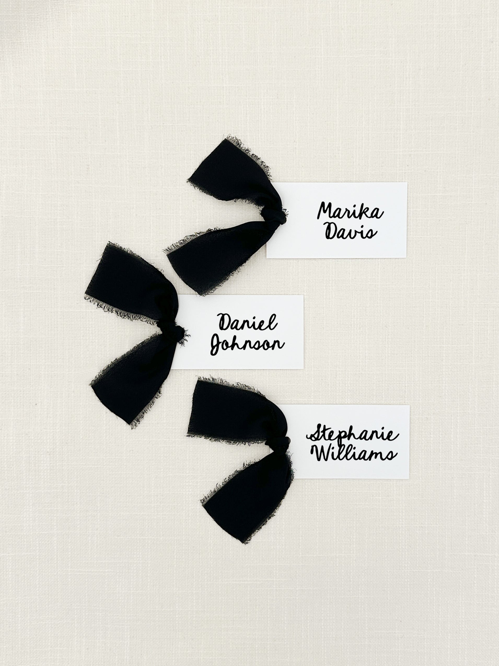 Personalized Hand Drawn Style Name Cards with Chiffon Ribbon that are printed for you with black ink on thick, smooth, white card stock and include the ribbon! You can choose the color of ribbon. Perfect for any occasion:

Weddings and Rehearsal Dinners
Baby Shower, Bridal Shower, Wedding Shower
Business Party, Corporate Event
Events with assigned seating