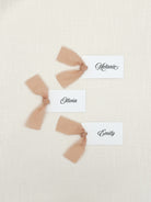 Personalized Fancy Name Cards with Chiffon Ribbon that are printed for you with black ink on thick, smooth, white card stock and include the ribbon! You can choose the color of ribbon. Perfect for any occasion:

Weddings and Rehearsal Dinners, Baby Shower, Bridal Shower, Wedding Shower, Business Party, Corporate Event or Events with assigned seating