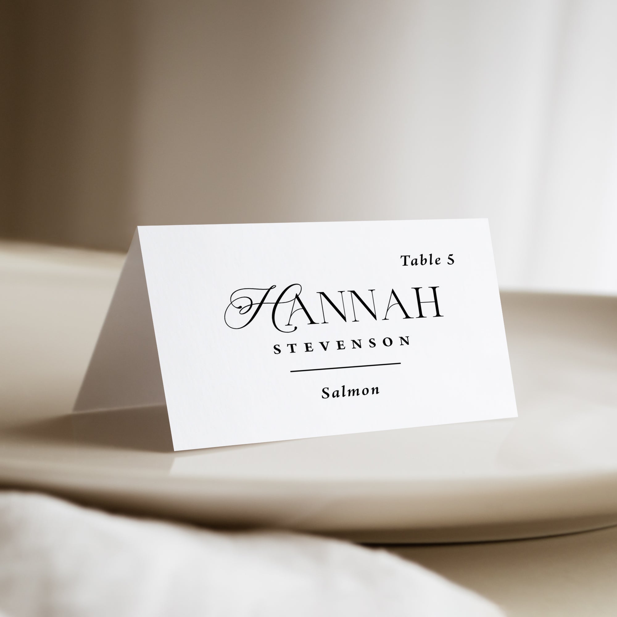 Place cards that are printed and personalized. These tented name cards can have the table numbers and meal choices. 