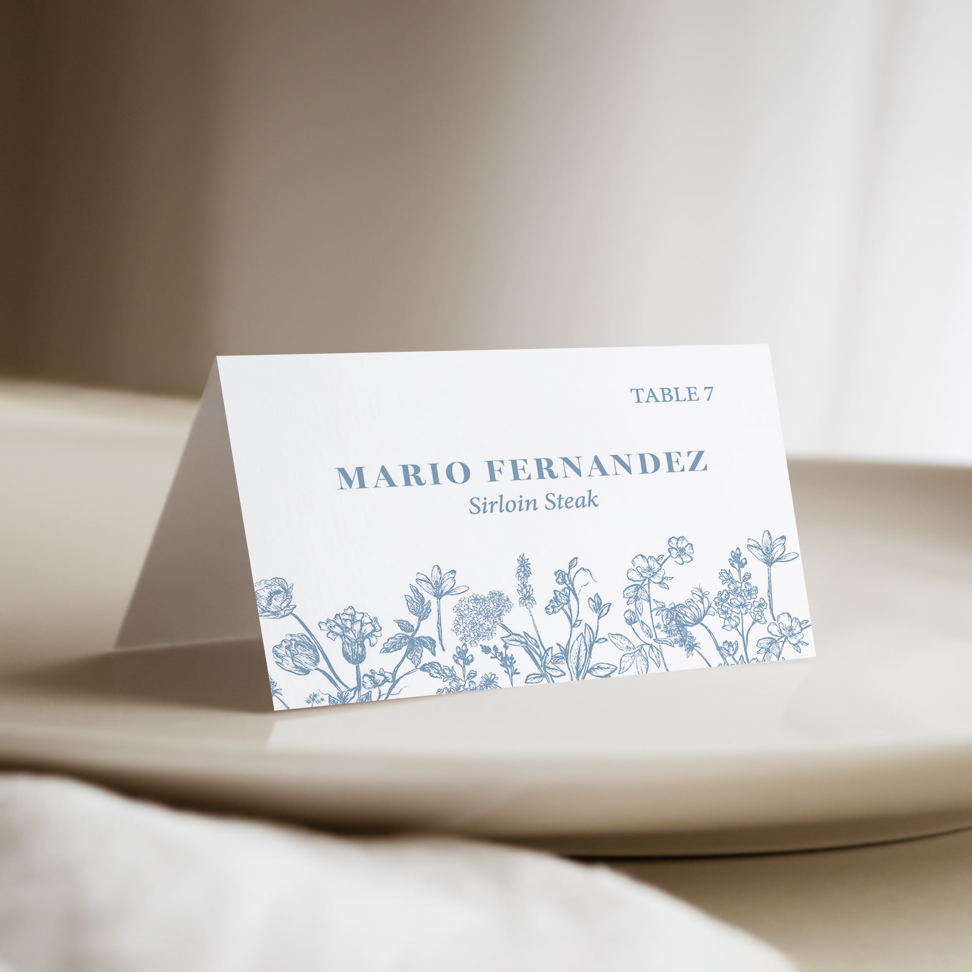 Bring a touch of natural beauty to your wedding with our personalized dusty blue French toile floral place cards with meal choice. Not only do they guide your guests to their seats, but they also add a romantic, floral touch to your wedding reception décor.