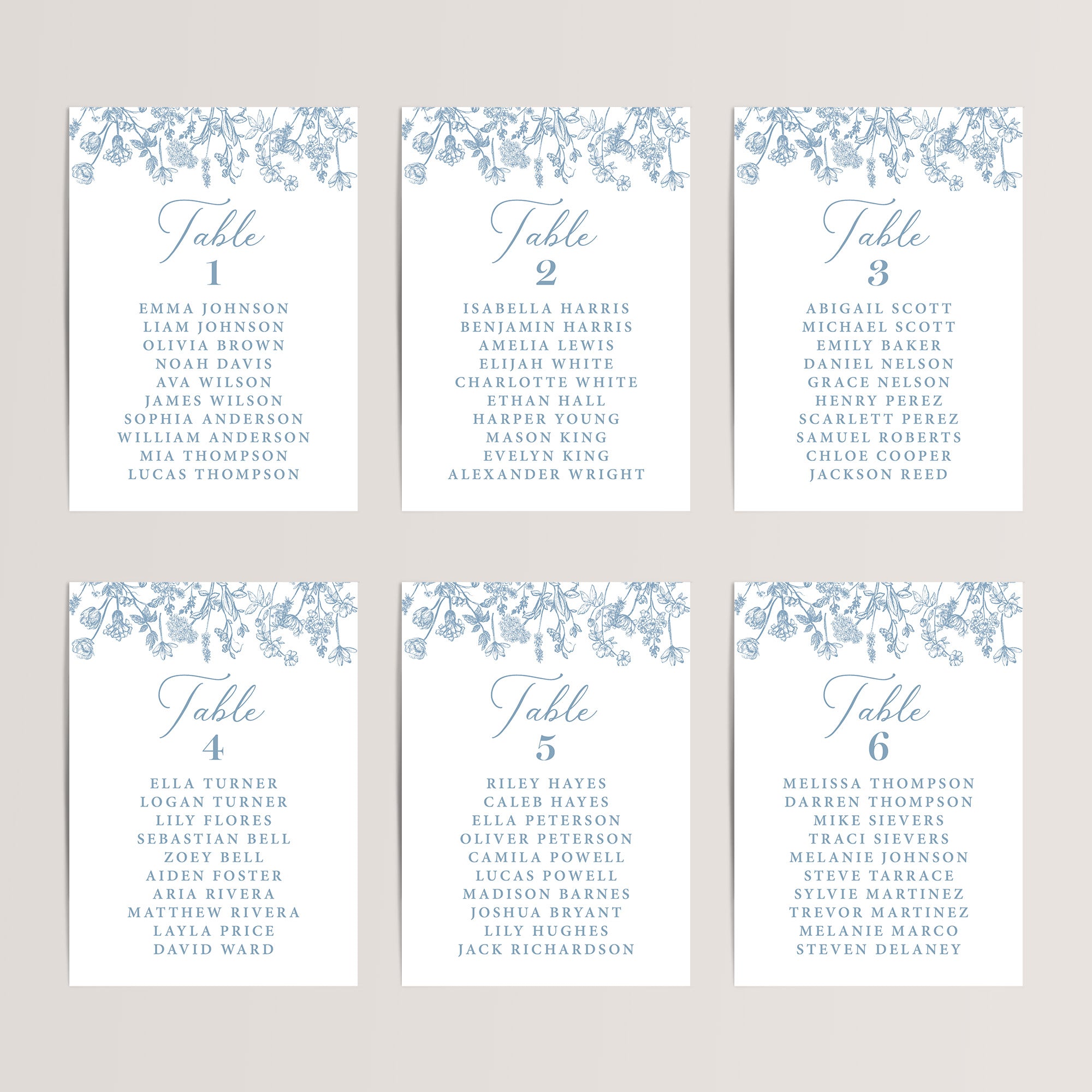 Simple wedding seating chart cards with dusty blue French toile florals that are printed for you on nice, thick card stock. These table seating arrangement signs are perfect wedding reception decor.