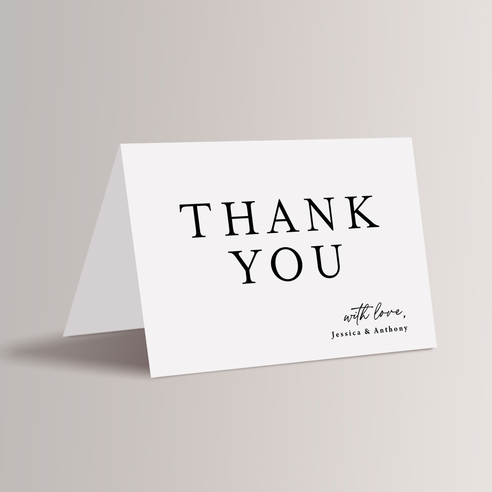 Minimalist wedding thank you card that is personalized with the names. 