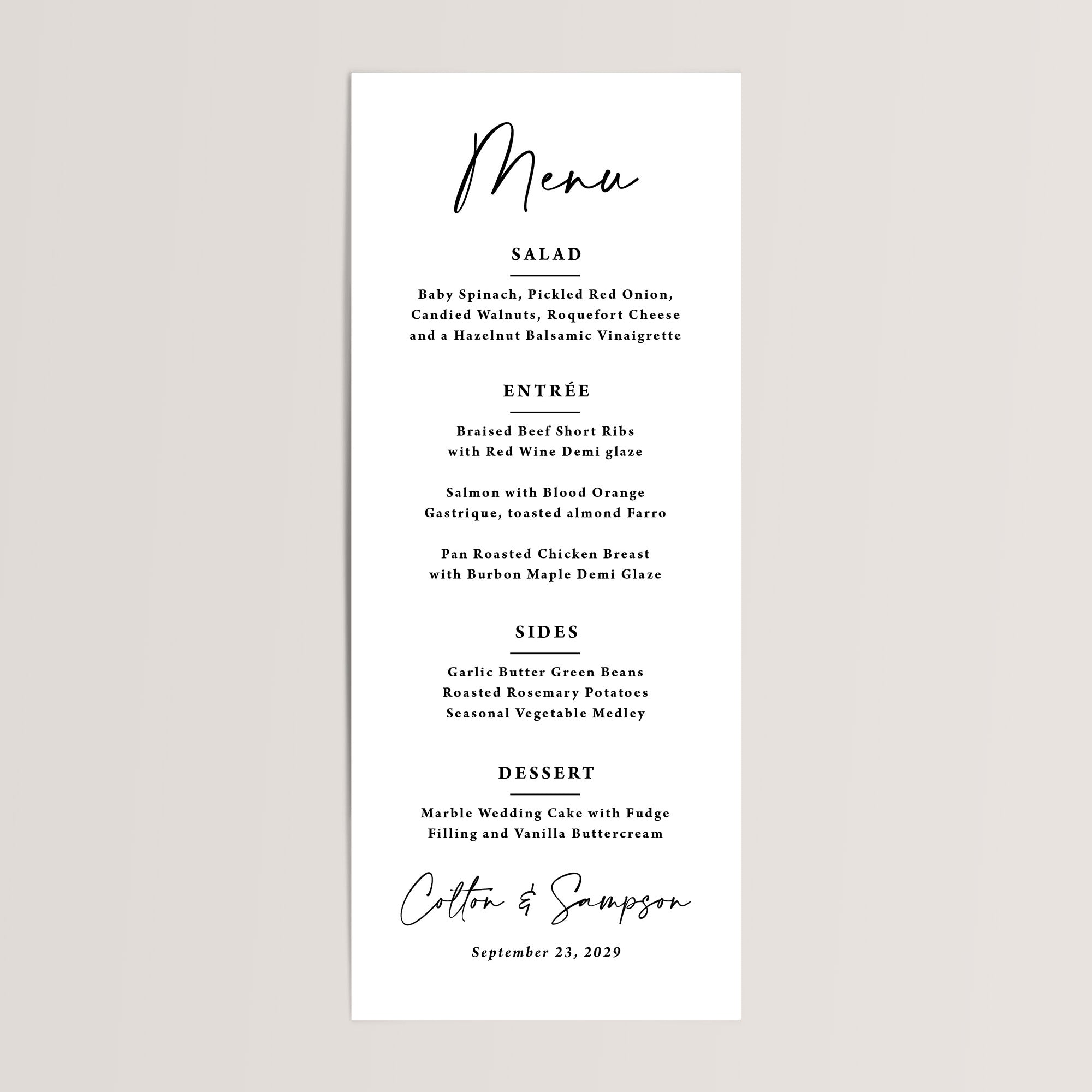 Black and White Menu. Menu is in a large script font, the headings are an all caps, serif font, the food descriptions are also in a serif font. The bottom of the menu features the couples names in the same script font and the wedding date below in an italic serif font.