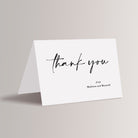 Printed modern wedding thank you cards that have the couple's names personalized. These come with blank, white envelopes. 