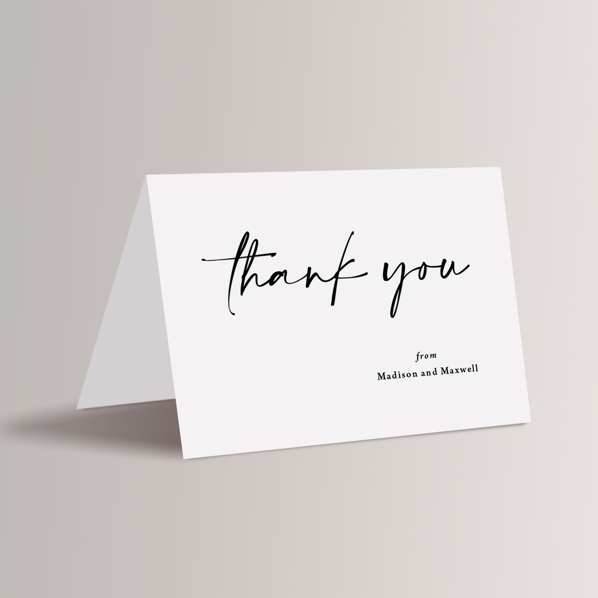 Printed modern wedding thank you cards that have the couple's names personalized. These come with blank, white envelopes. 
