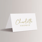 Add a touch of elegance to your wedding reception, rehearsal dinner, birthday party or business party with our personalized wedding place cards. Featuring a minimalist gold and white design with a sophisticated script font, these printed place cards are perfect for any modern or simple wedding.&nbsp;